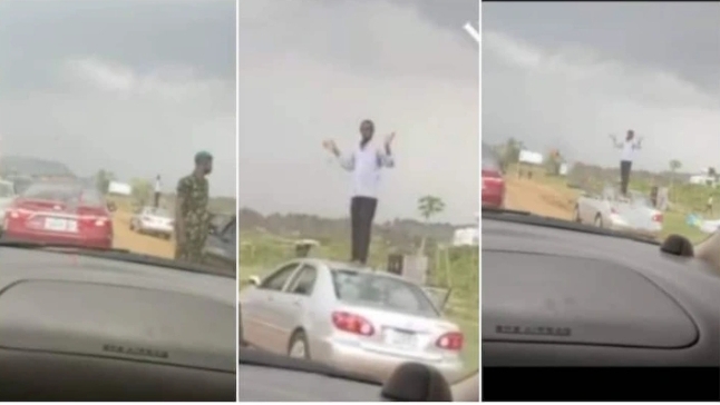 Man Drives Against Traffic In Abuja, Soldier Catches Him, Orders Him To Stand On His Car