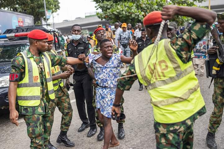 Soldiers Flog Man For Smoking Illegal Substances At Lagos APC Mega Rally