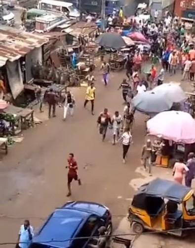 Watch moment unknown gunmen chased traders and buyers out of Onitsha main market