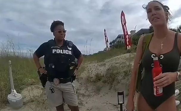 Police arrest woman after caught moaning while m@sturbating with vibrator on a beach