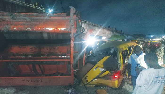 Moment Refuse Truck Falls Off Lagos Bridge, Kills Tricycle Rider