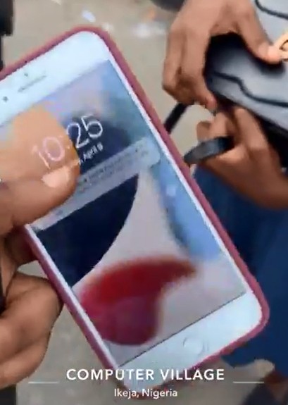 Lady In Pain At Computer Village After Being Sold Faulty iPhone