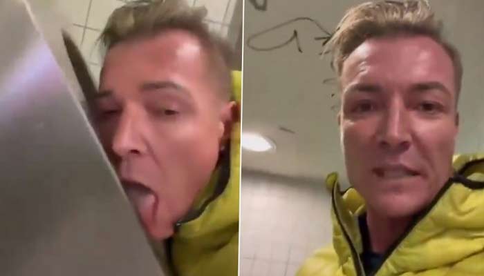 Moment German Politician licks public toilet seats